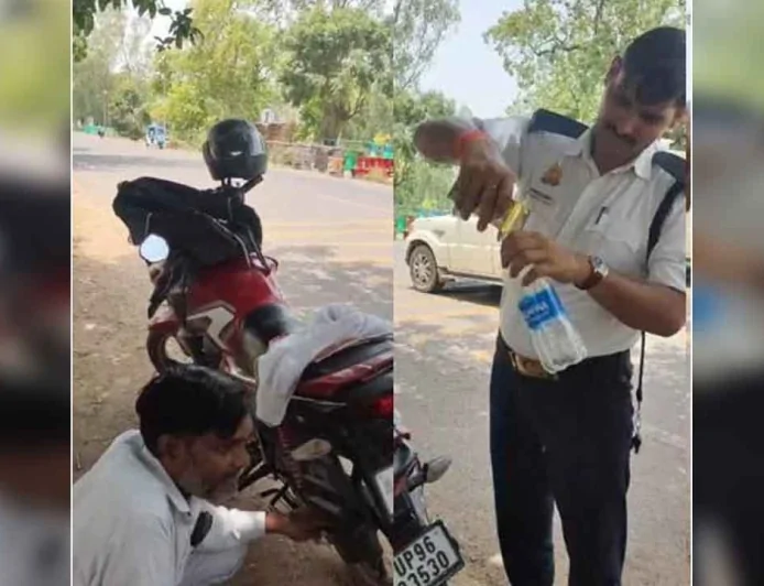 ट्रैफिक पुलिस ने लू की चपेट में आये बाइक सवार की मदद की